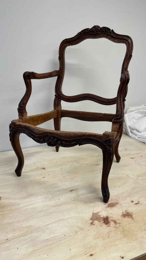 Luxury reupholstered antique chair crafted by European-trained artisans for a bespoke interior setting