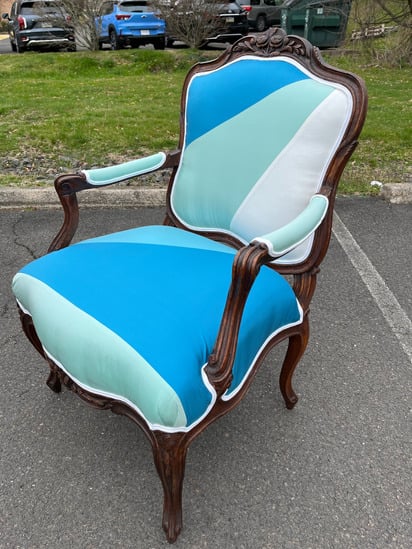 Luxury reupholstered antique chair crafted by European-trained artisans for a bespoke interior setting