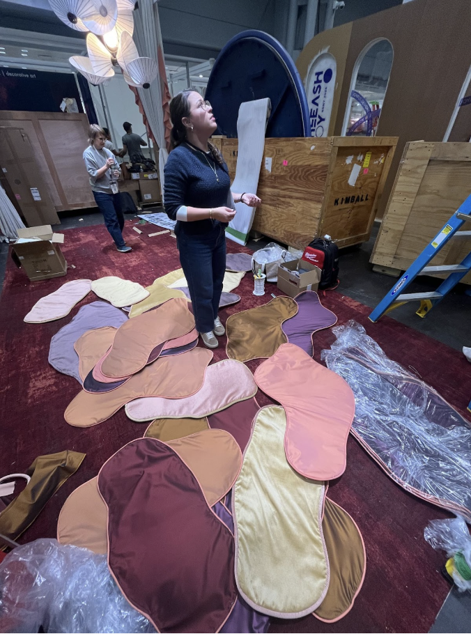 Installing custom drapery panels at Javits Center for BDNY 2025