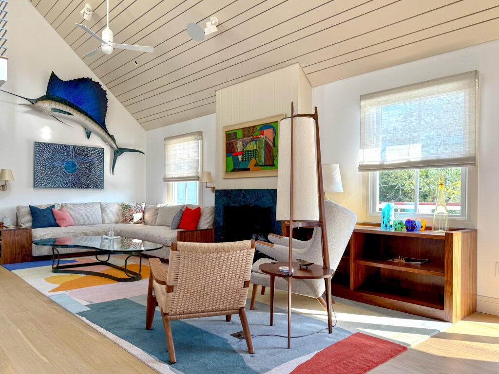 Motorized Conrad woven wood shades in a Cape May beach house living room, interior design by Michael Shannon Design