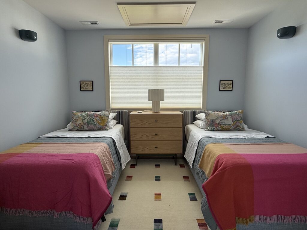 Hunter Douglas Duette top-down bottom-up cellular shades in beach house guest bedroom, motorized hardwired installation by Vitalia Inc