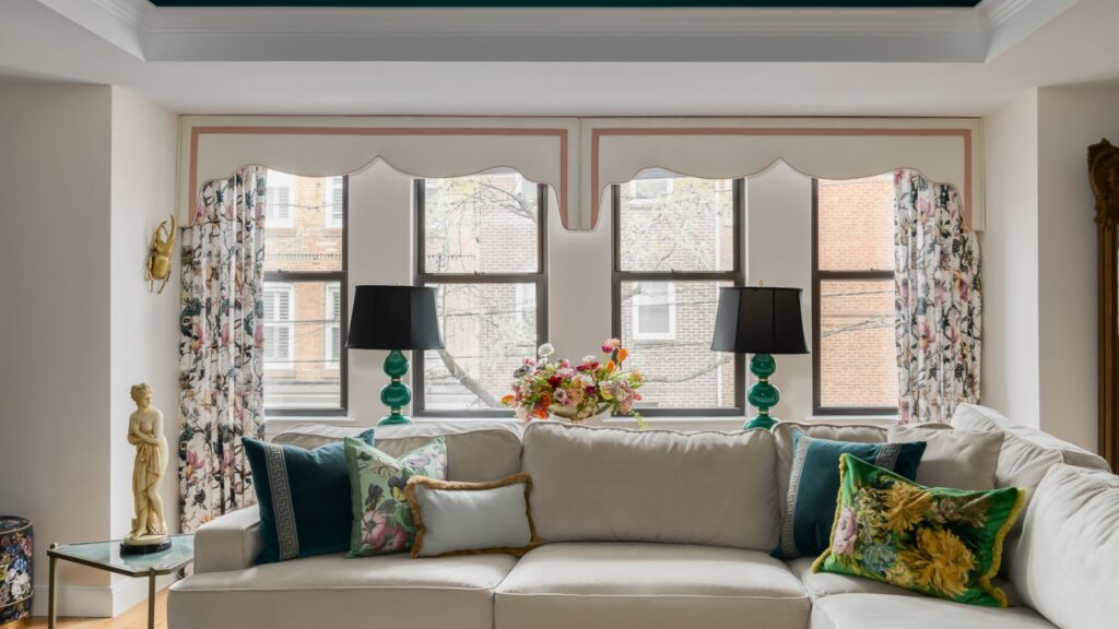 Custom scalloped lambrequin cornice with contrast banding and floral drapery panels fabricated by Vitalia Inc. in collaboration with Lost Orchid Interiors